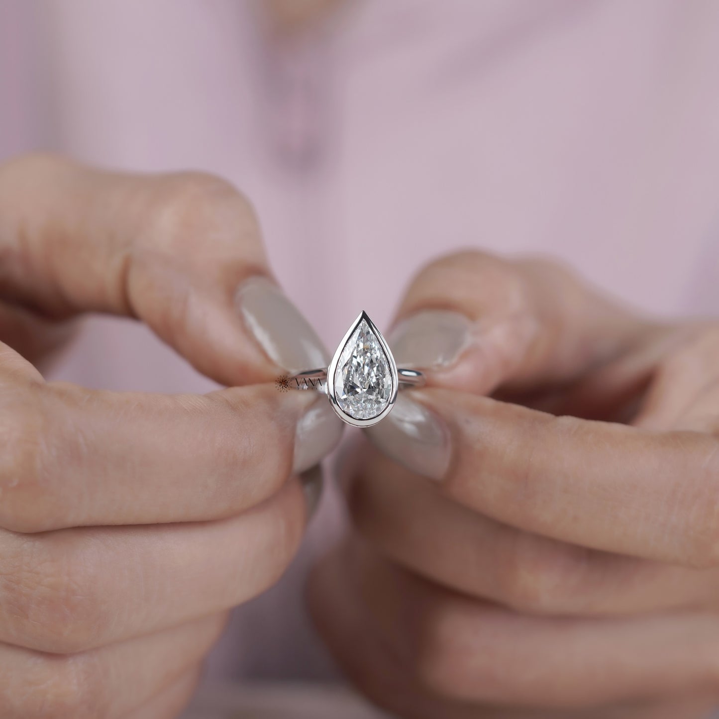 Bezel Set Pear Cut Lab Grown Diamond Solitaire Ring with Hidden Halo Setting