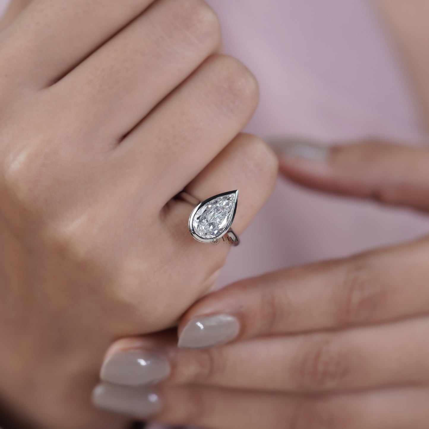 Bezel Set Pear Cut Lab Grown Diamond Solitaire Ring with Hidden Halo Setting