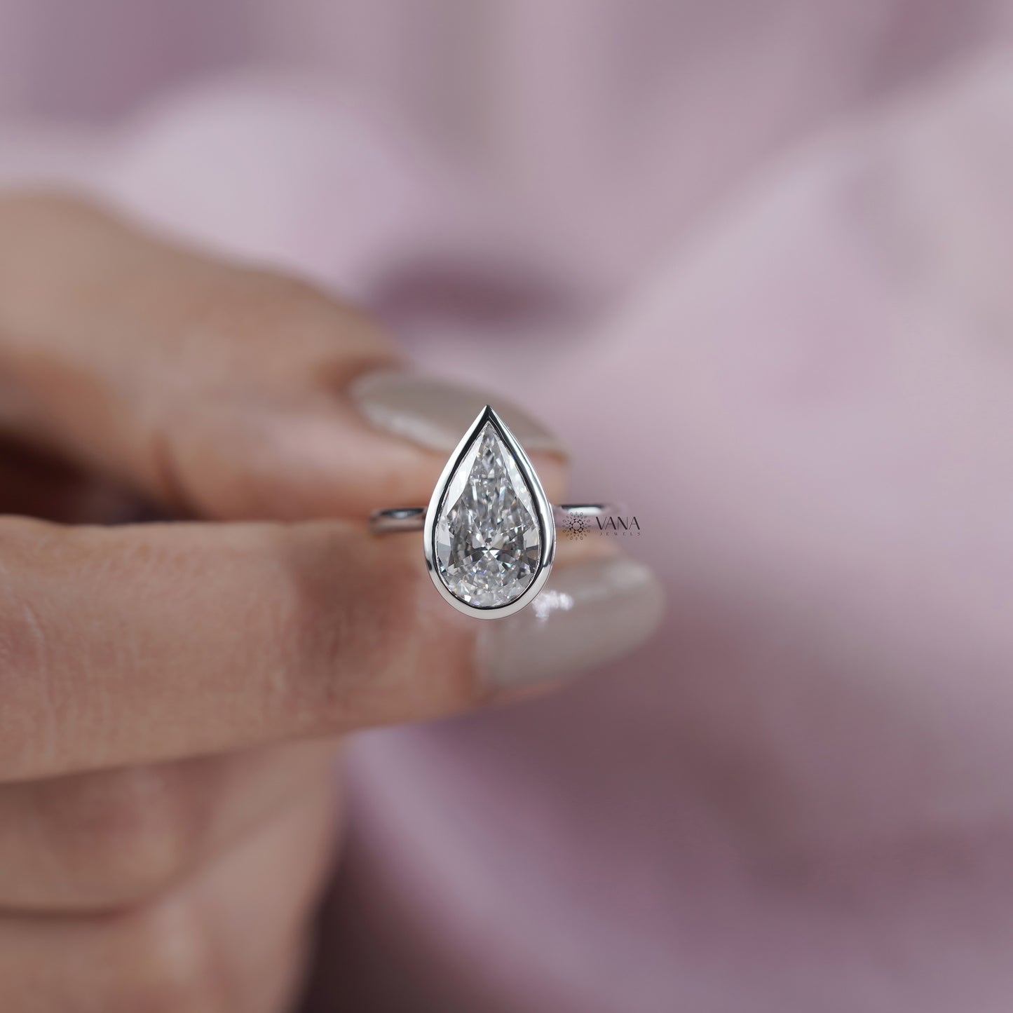 Bezel Set Pear Cut Lab Grown Diamond Solitaire Ring with Hidden Halo Setting