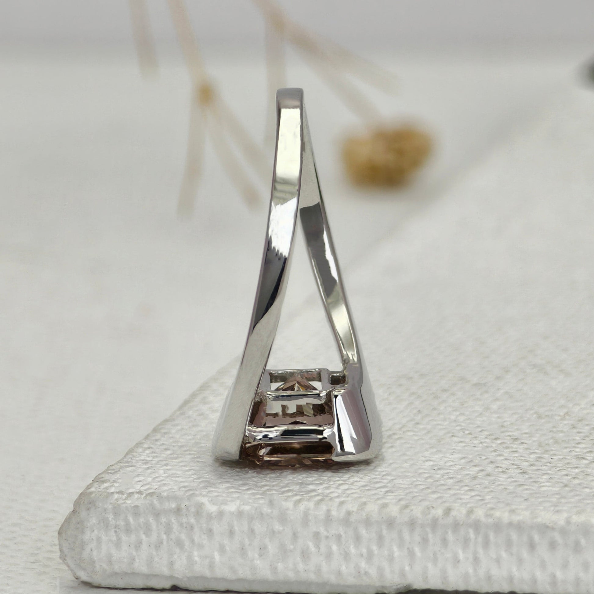 Elegant tension style brown diamond engagement ring

