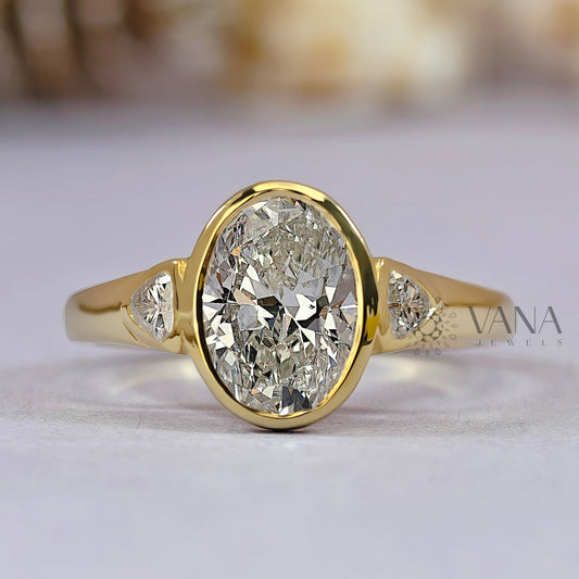 Oval Cut Moissanite Three Stone Bezel Set Engagement Ring in Yellow Gold