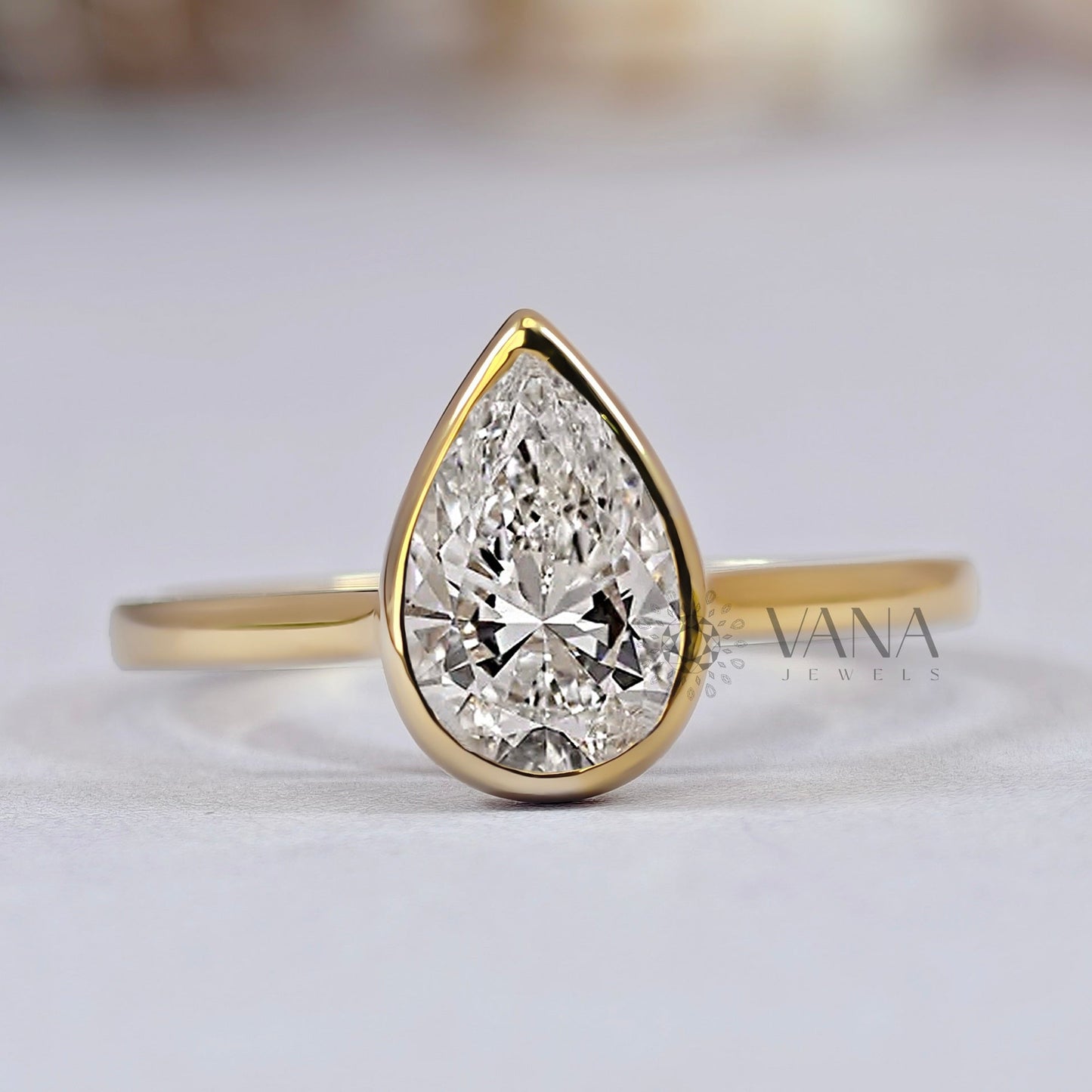 Bezel Set Pear Cut Moissanite Solitaire Engagement Ring with Cathedral Setting
