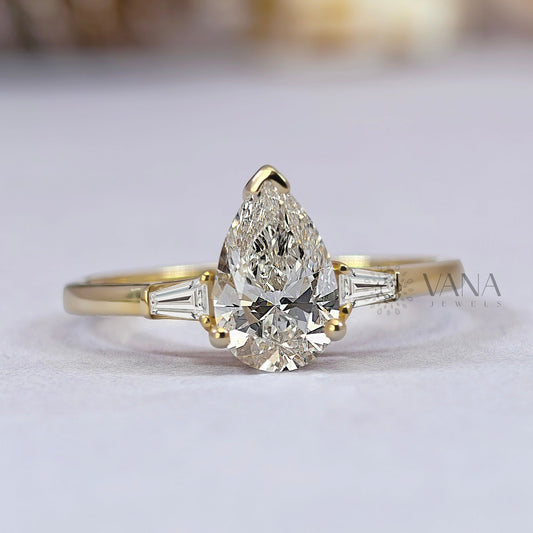 Pear Cut Moissanite Three Stone Engagement Ring with Tapered Baguette Side Stones