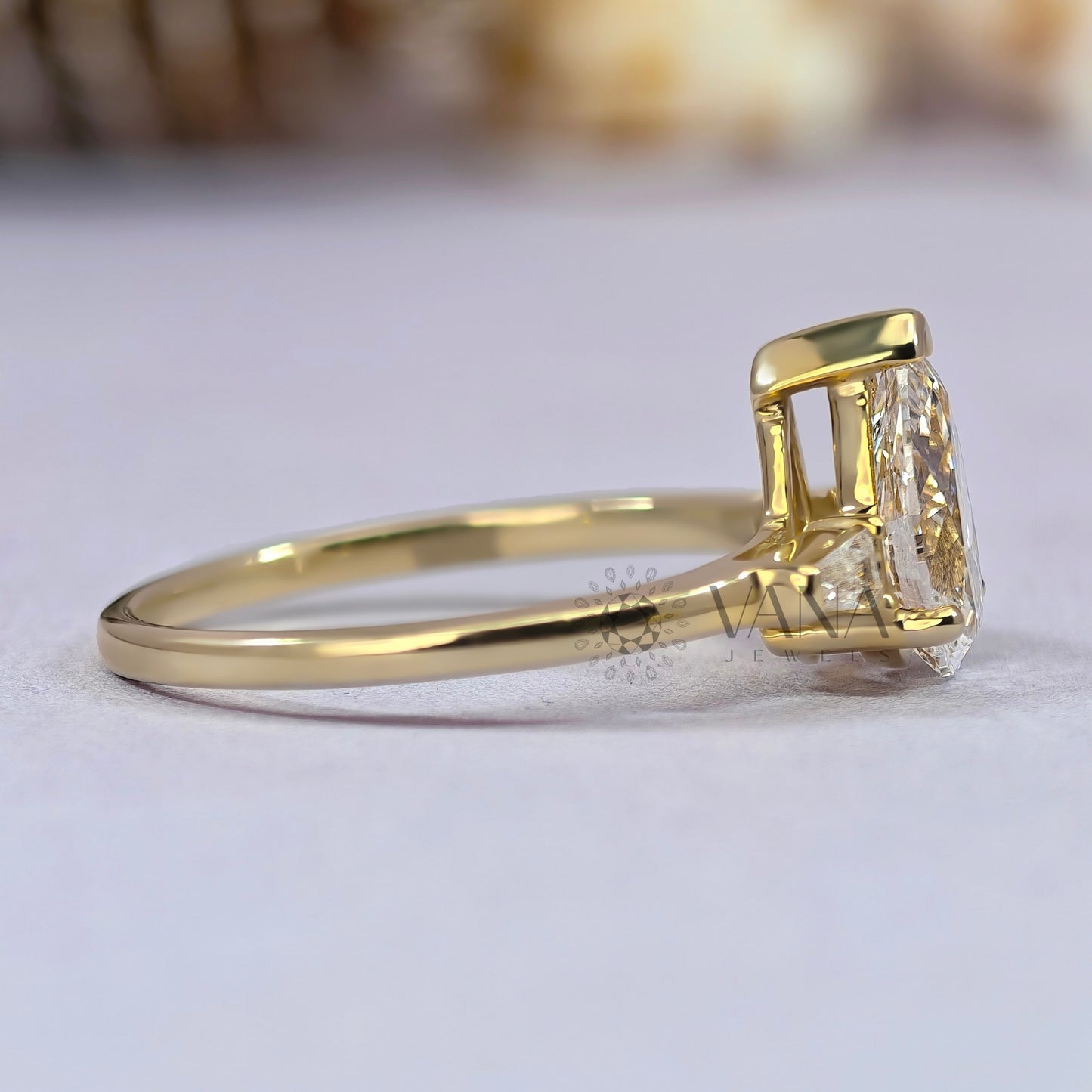 Pear Cut Moissanite Three Stone Engagement Ring with Tapered Baguette Side Stones