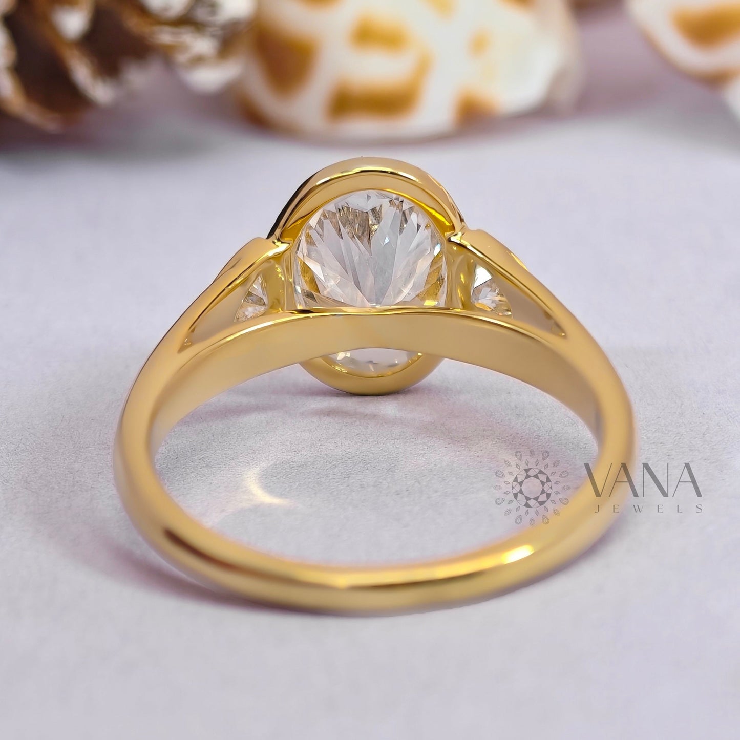 Oval Cut Moissanite Three Stone Bezel Set Engagement Ring in Yellow Gold