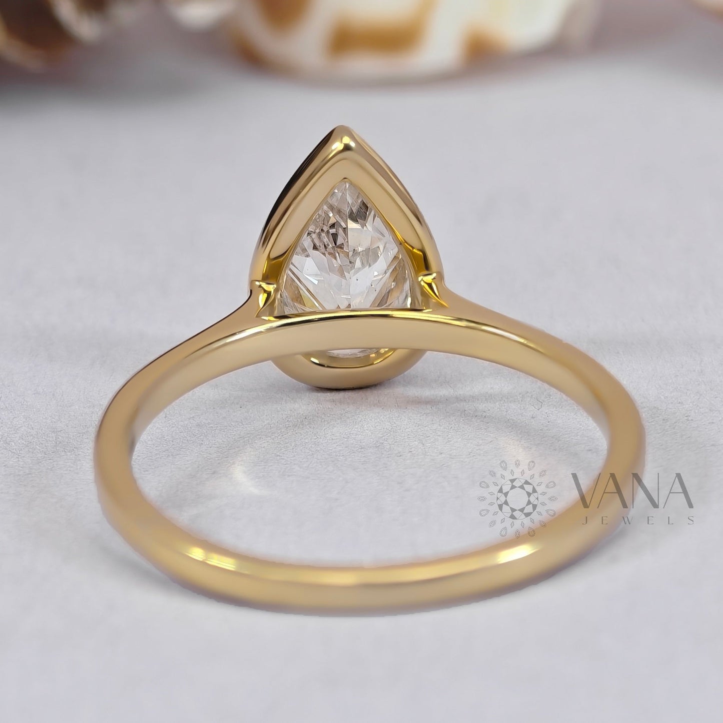 Bezel Set Pear Cut Moissanite Solitaire Engagement Ring with Cathedral Setting