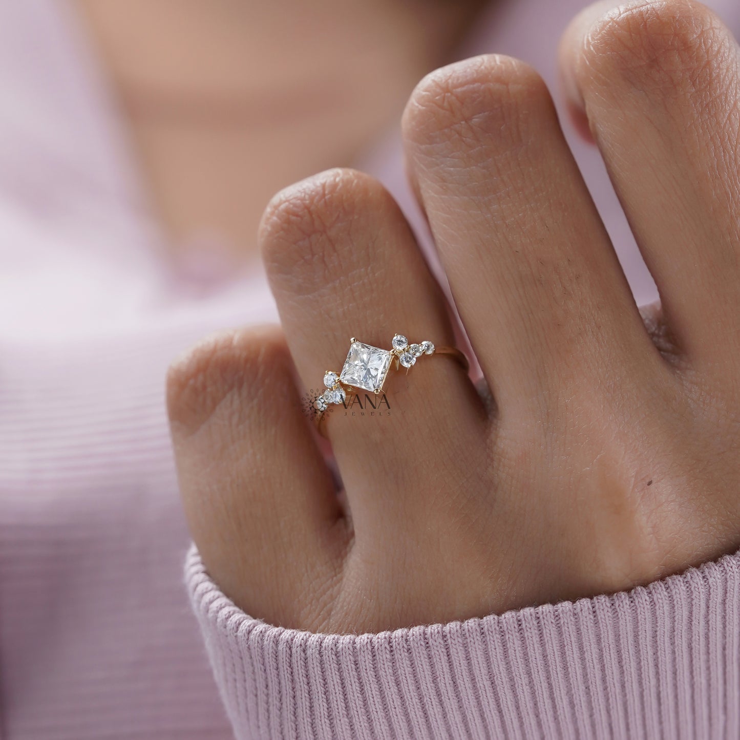 Modern princess and round diamond engagement ring 
