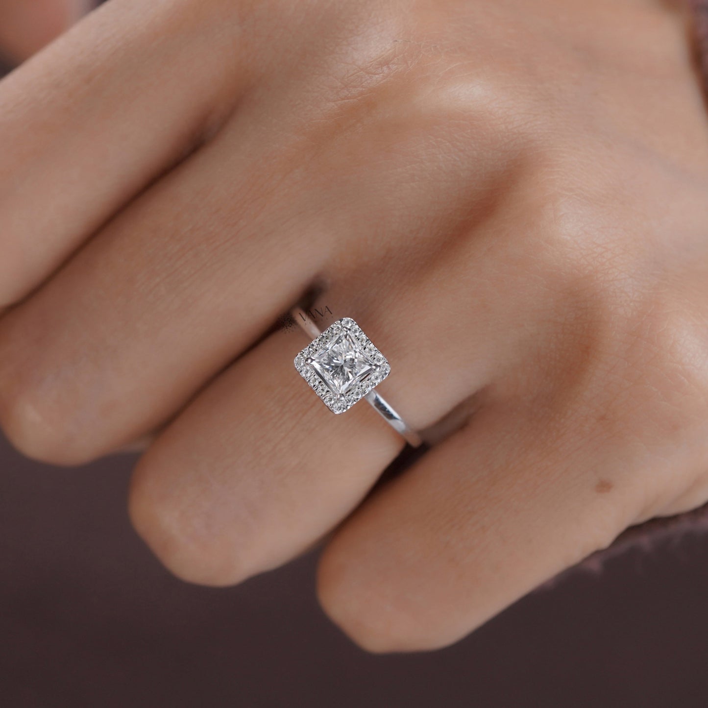 Handmade moissanite engagement ring featuring princess cut center stone