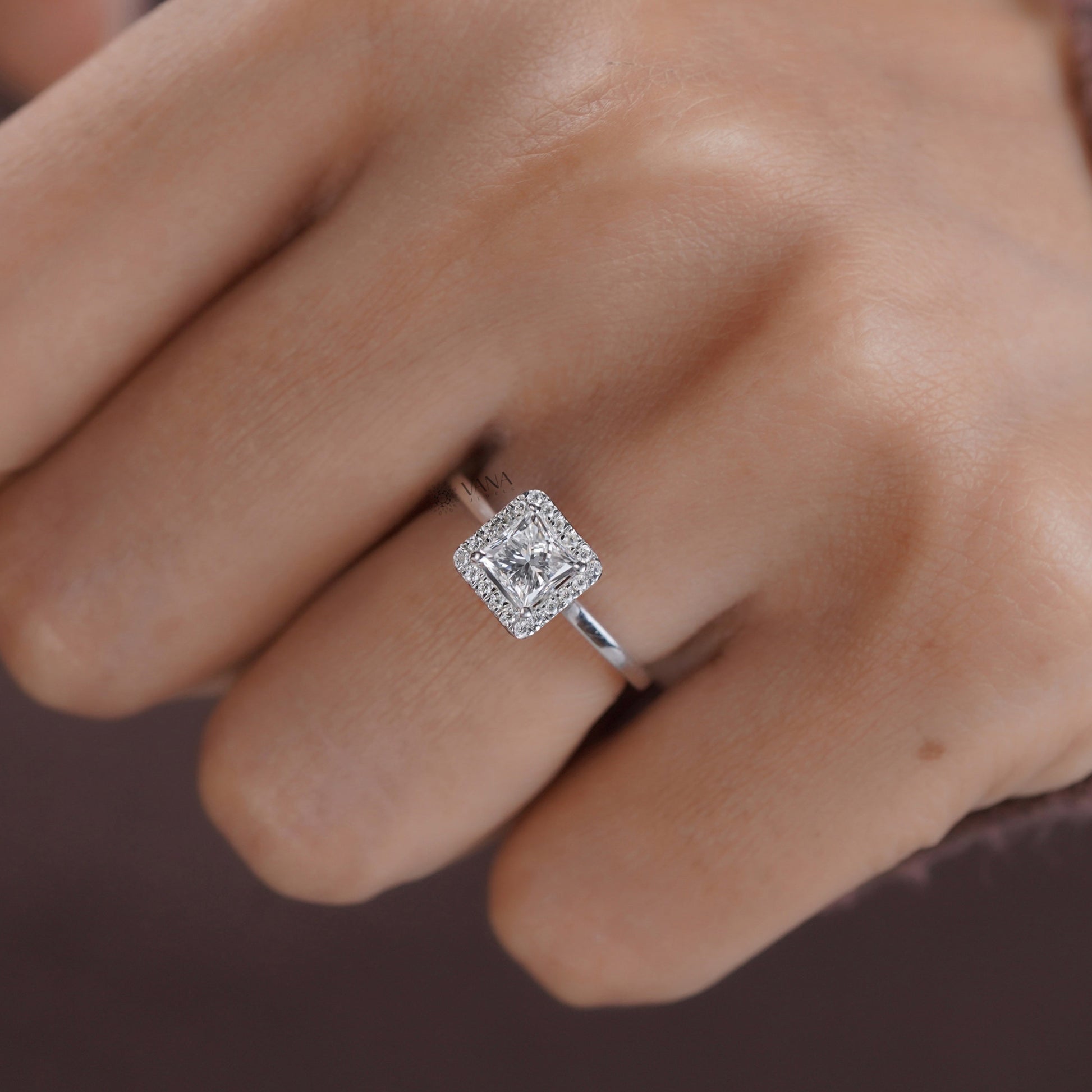 Handmade moissanite engagement ring featuring princess cut center stone