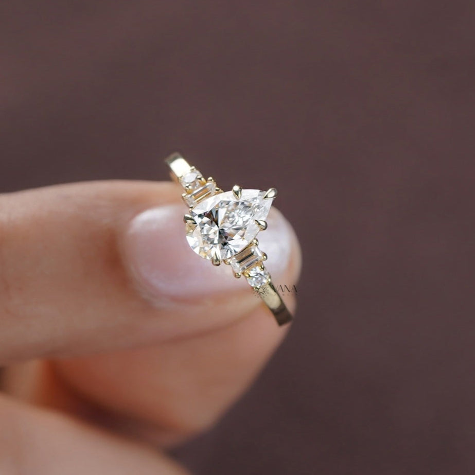 Timeless pear engagement ring with round and baguette cut