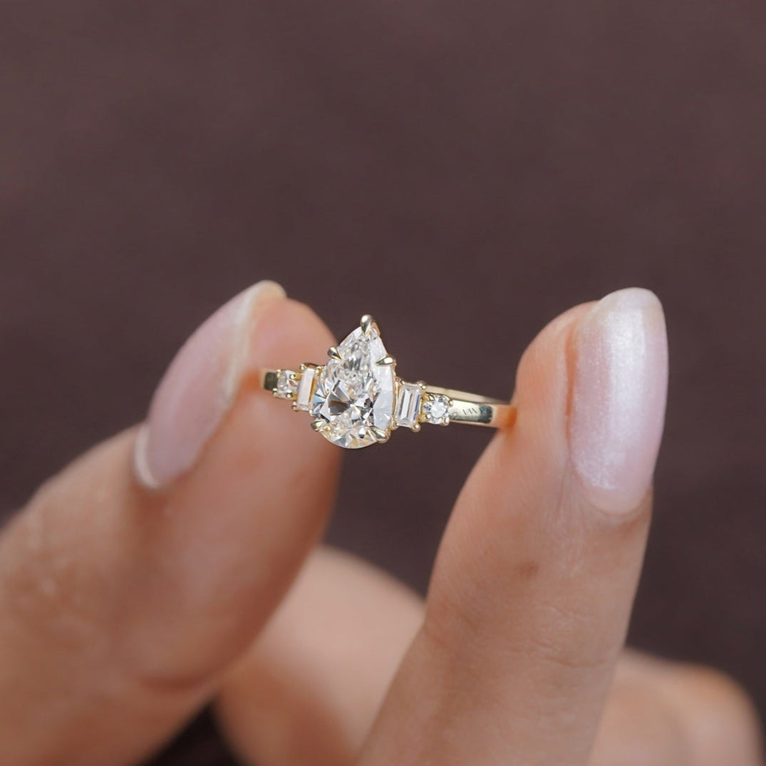 Sparkling pear and baguette moissanite ring for proposal or anniversary